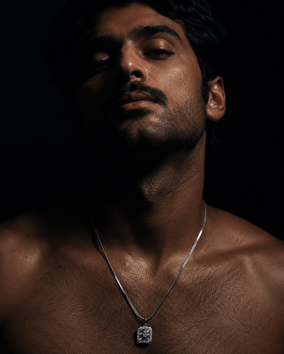 Men's Iced Square Silver Pendant Necklace worn by male model on dark background