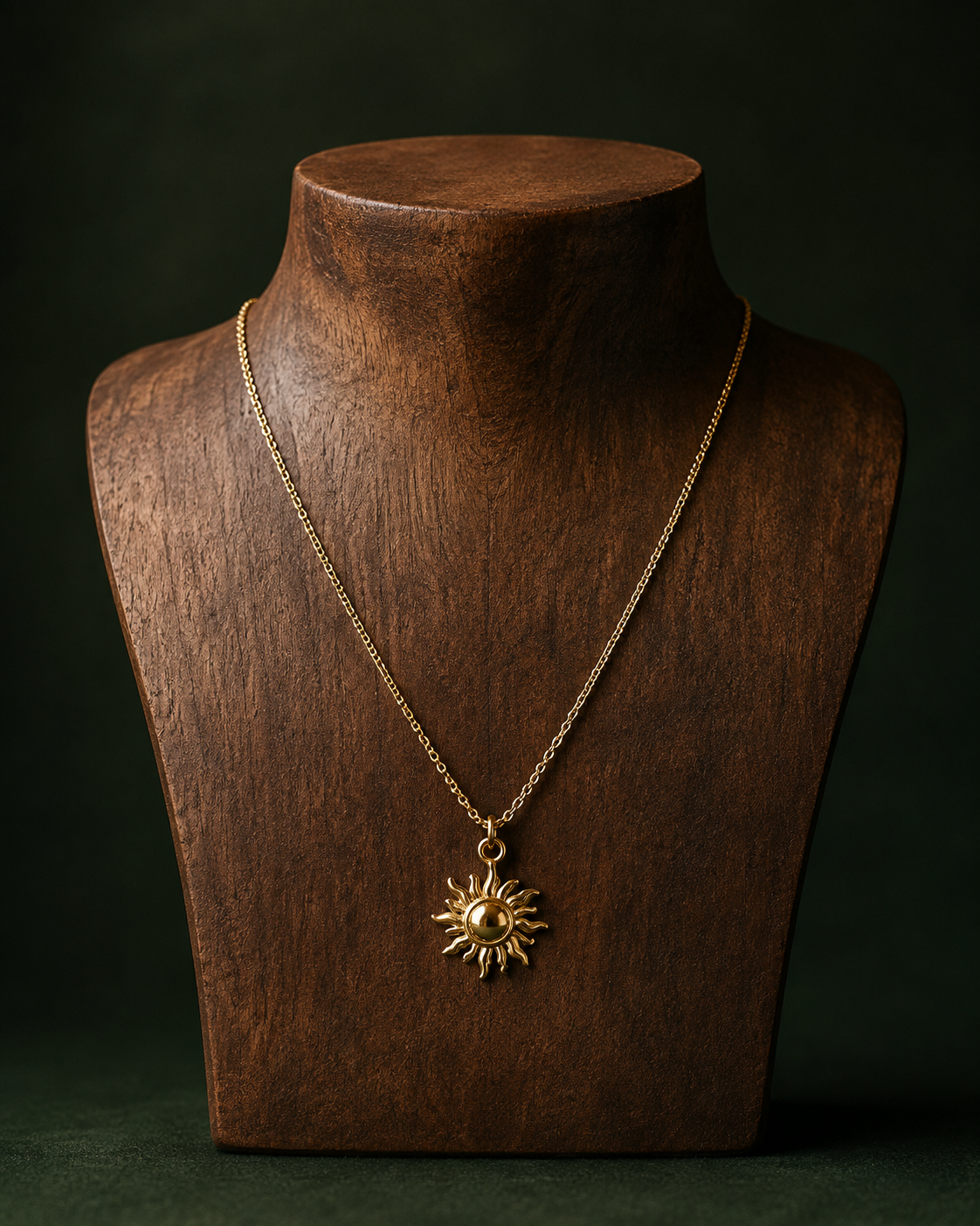 Radiant Sunburst Gold Pendant Necklace displayed on a wooden jewelry bust