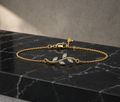 Dainty Crystal Leaf Bracelet on black marble surface