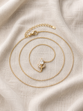 Dainty Crystal Flower Pendant Necklace on linen fabric